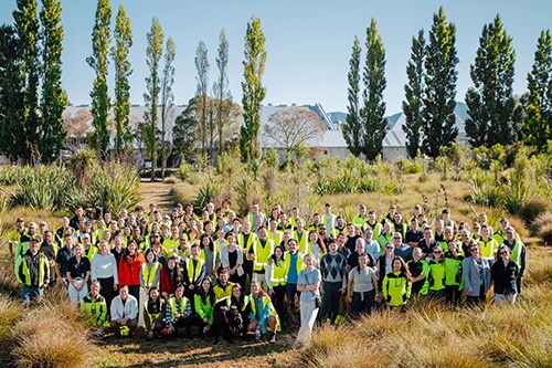 Group of the Cloudy Bay team standing in the garden